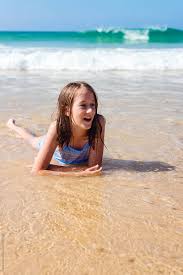 Young teen girl стоковые фото, картинки и изображения. Young Teen Lying In The Surf By Gillian Vann Surf