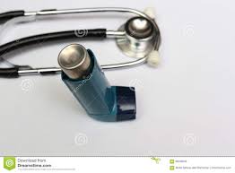 Stethoscope And Asthma Inhaler For Medical Stock Photo
