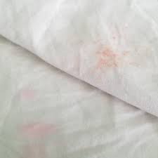 bright pink stains on washed clothes help