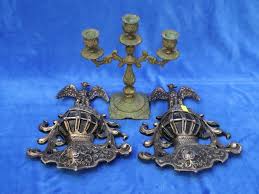 Pair Of Cast Metal Wall Plaques Plus A