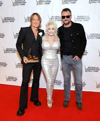 dolly parton shines in silver at
