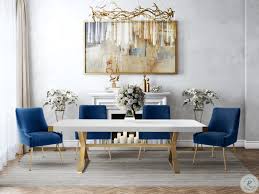 To tie everything together, display a few palm leaves in a vase on the. Beatrix Navy Velvet Side Chair In 2020 Dining Table Gold Gold Dining Room Dining Chairs