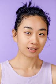 young asian woman no makeup and smiling
