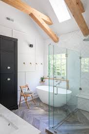 Their master bathroom is an eclectic take on modern farmhouse, with biophilic elements that connect the room to nature. Black White Modern Farmhouse Bathroom Home Bunch Interior Design Ideas