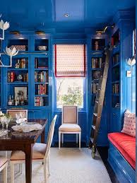 This industrial dining space is made so much chicer with the inclusion of navy walls. Glossy Blue Lacquered Dining Room Walls Design Ideas