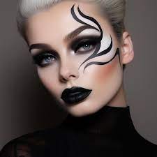 a woman with a black makeup and black