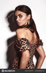 beautiful y woman in a leopard dress