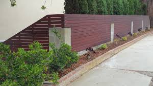 custom horizontal wood fence atop