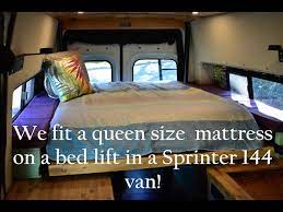 queen size mattress on a bed lift in a