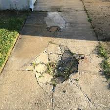 how to fix holes in a concrete driveway