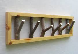 Pallets have been used as the rack while tree branches have been inserted in as hanging hooks. Tree Branch Hook Coat Rack Heavy Duty Decoratorist 84620