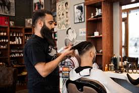 barber cutting customer s hair stockphoto