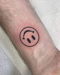 20 cheerful happy face tattoo designs
