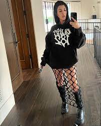 Kourtney Kardashian poses in a thong & fishnets as she sports 'tour wife'  looks ahead of Travis Barker's Blink-182 tour | The Sun