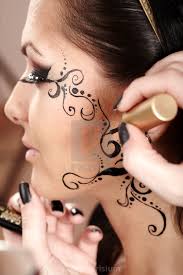 applied face tattoo by makeup artist