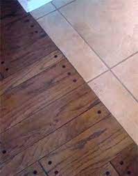 installing hardwood against tile