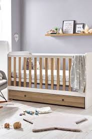 parker white and wood effect cot to