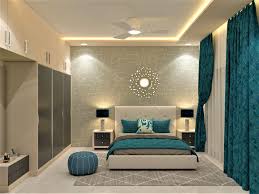 a grey bedroom design with teal