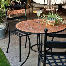 patio bistro set with terra cotta tiles