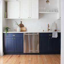 Dark blue cabinets with dark leather pulls and marble countertops give this kitchen a sophisticated scandinavian feel. Navy Blue Paint Options For Kitchen Cabinets
