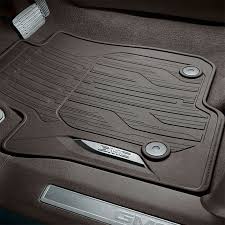 gmc accessories first row premium all weather floor mats in very dark atmosphere with gmc script