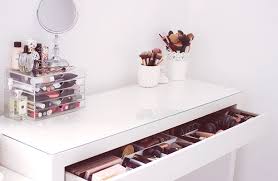 organizing makeup in a shelf cupboard