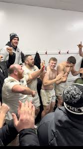 rhys henry leads the celebrations after