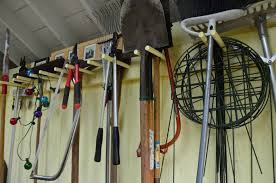 There are also small hooks under the large hangers to hold up to 8 more tools for up to 16. Garden Tool Storage Hooks