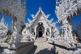 The small white chapel near the base of the gum tree houses a log from the original chiang mai city pillar (sao inthakin) which is believed to protect the city and is home. Inside Thailand S Bizarrely Beautiful Wat Rong Khun White Temple Thailand White Temple Thailand Pictures