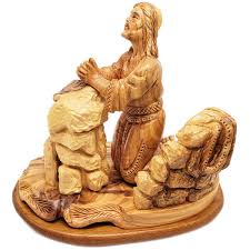 olive wood carving praying in