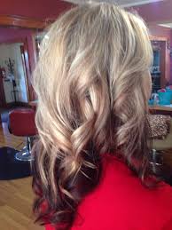 Darker lowlights are swept throughout the more dominating white blonde hair that makes for a delicate but gorgeous color combination. Platinum Blonde With Chocolate Lowlights And Burgundy Underneath Burgundy Hair Gorgeous Hair Color Hair Color Streaks