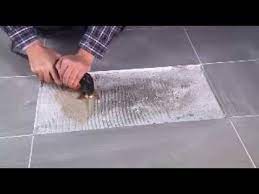 removing tile adhesive with the