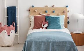 a toddler bed and a twin bed