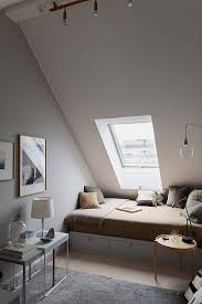A Bedroom With A Slanted Ceiling