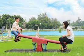 Also likely influenced by the verbs see and saw of either present or past tense. Mother With Son Playing Seesaw In The Park Stock Photo Picture And Royalty Free Image Image 81186123