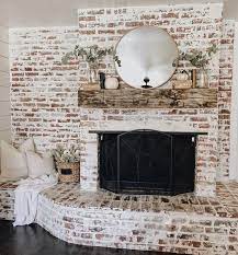beautiful limewash brick fireplace it