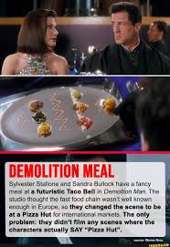 DEMOLITION MEAL Sylvester Stallone and Sandra Bullock have a fancy meal at  a futuristic Taco Bell