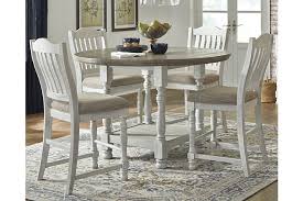 The dining table is made of durable metal and tempered glass that has a dark. Havalance Counter Height Dining Table Ashley Furniture Homestore