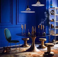 Blue dining room interior with a wooden floor, a white wooden table and chairs and a framed poster on the wall. 10 Best Dining Room Colour Ideas For Inspiration Inspiration Furniture And Choice