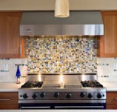 Slightly rock the sheet up and down, perpendicular to the trowel lines, to collapse the ridges and help the tile settle into place. How To Install A Glass Tile Kitchen Backsplash How To Diy Blog Plumbtile