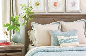 to arrange decorative toss pillows on bed