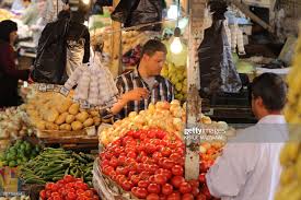 People buy fruits and vegetable at a market in downtown Amman on June...  News Photo - Getty Images