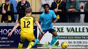 nelson iseguan signs for tiverton town