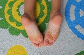 child suffering from severe foot pain