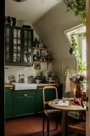 a cozy green kitchen in a vine attic