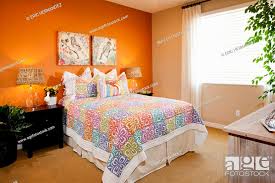 Interior Of Tidy Bedroom With Orange