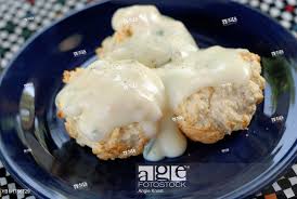 stock photo homemade drop biscuits covered in country style milk gravy and pepper lacto ovo vegetarian