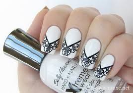 The single gold nail, the golden designs on the ring fingers, and the slashes of gold accents across the black and white nails add a touch of color and glimmer. 30 Stylish Black White Nail Art Designs For Creative Juice