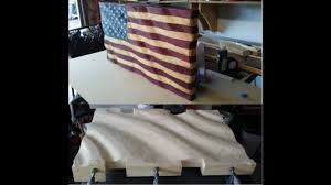 caving a wavy wooden american flag