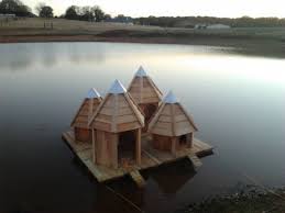 I also made some retractable walking planks so the ducklings could get up safe. Pond Decor Floating Duck House